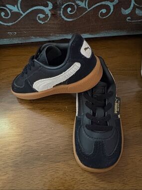 Puma Kids Black Suede Sneaker with White Stripe and Gum Sole